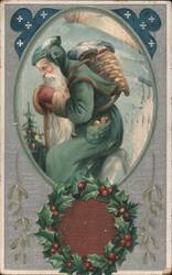 Santa Claus in Green Coat with Basket & Holly Wreath, Snowy Scene Postcard
