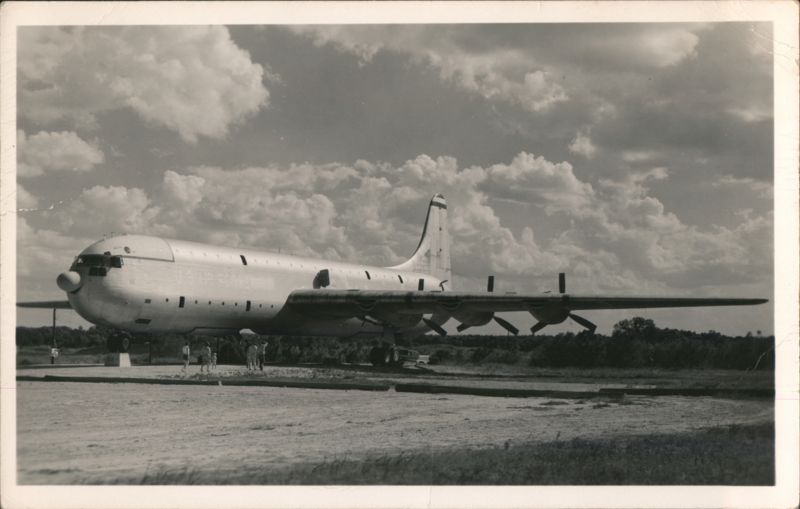 Convair XC-99 Large Propeller Aircraft on Airfield with People