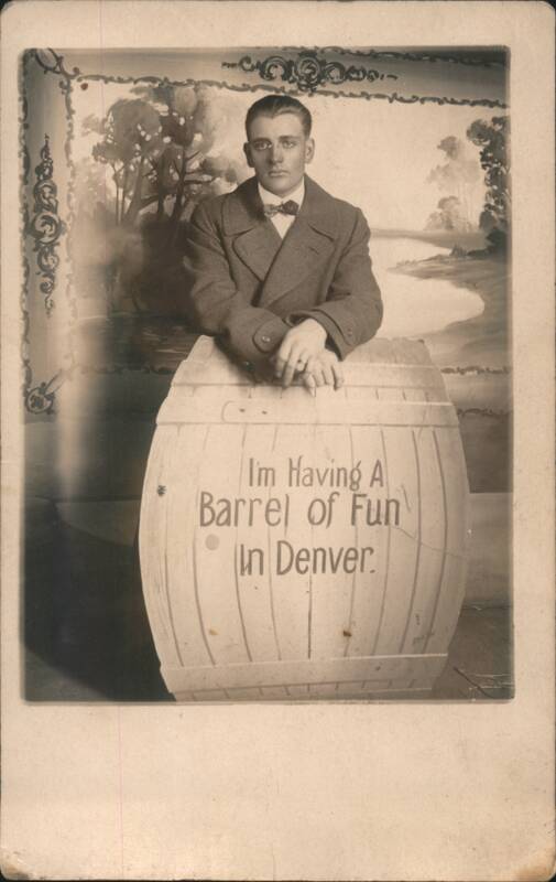 Man Posing with Barrel, 'Barrel of Fun' in Denver