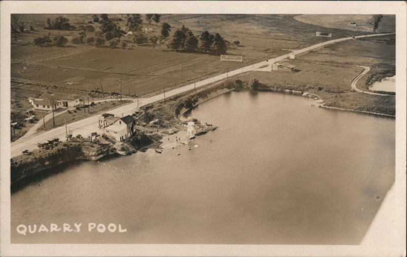 Quarry Pool Aerial View Swimming Area & Roadside Building