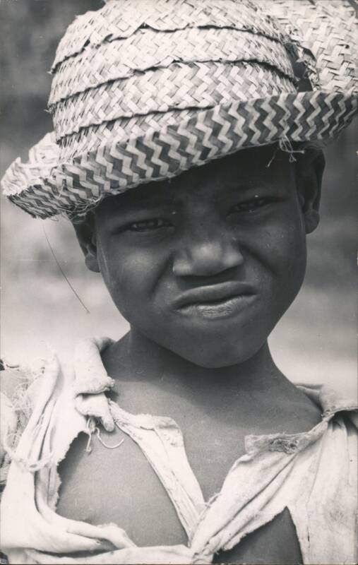 Boy in Straw Hat Making a Face
