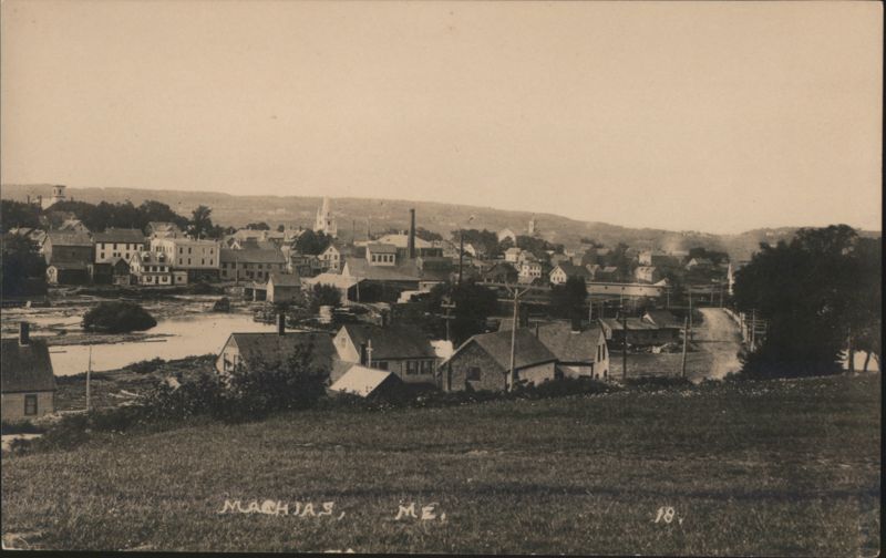Machias, ME Town View with River and Churches