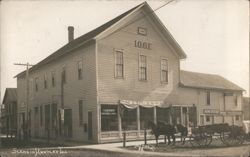 I.O.O.F. Building (1908), Millinery & Groceries Postcard