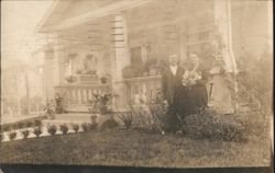 Man & Woman in Garden, House with Porch Postcard