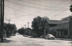 Street Scene, Bank of Eagle & Healy's Tap Postcard