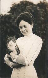 Smiling Woman in Lace Dress Holding Tabby Cat Postcard