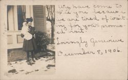1906 Woman holding baby in snow, Lovingly Genevieve Postcard