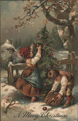 A Merry Christmas Children Decorating Tree in Snow Postcard