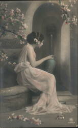 Woman in Flowing Gown by Fountain with Cherry Blossoms Postcard