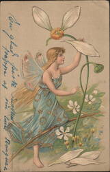 Blonde Fairy in Blue Dress Reaching for Large White Flower Postcard