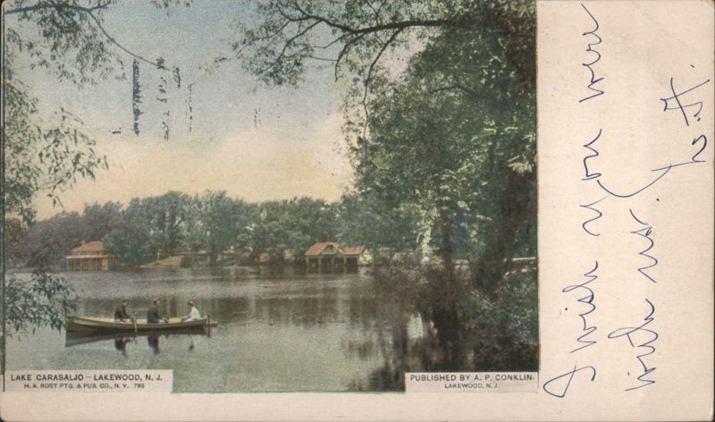 Lake Carasaljo with Rowboat and Shoreline Boathouses