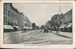 Main Street with Storefronts and Early Carriages Postcard