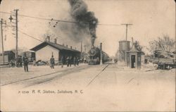 Railroad Station with Incoming Steam Locomotive Postcard