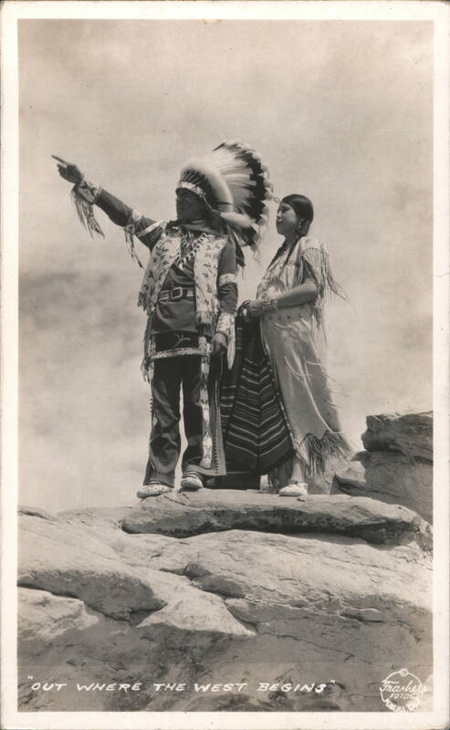 Native American Man and Woman in Traditional Regalia