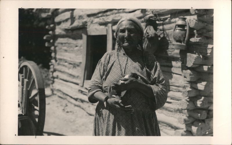 Native American Woman Holding a Puppy Native Americana