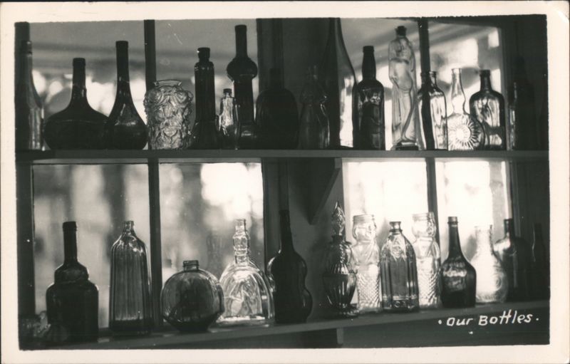 Collection of Glass Bottles on Shelves Photographic Art