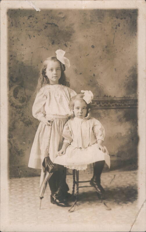Two Young Girls with Umbrella and Hair Bows Children