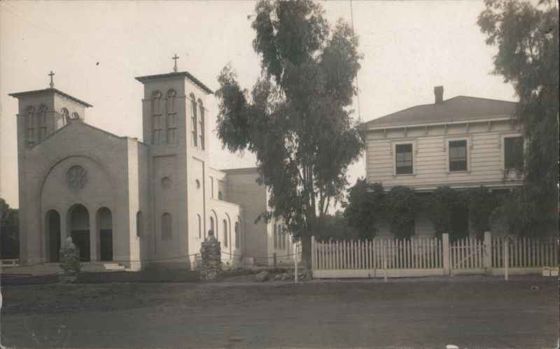 Catholic Church and Adjacent Residence with White Picket Fence Antioch California