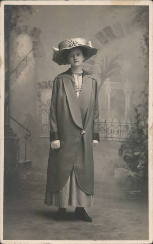 Portrait of a Woman in a Wide-Brimmed Hat and Long Coat
