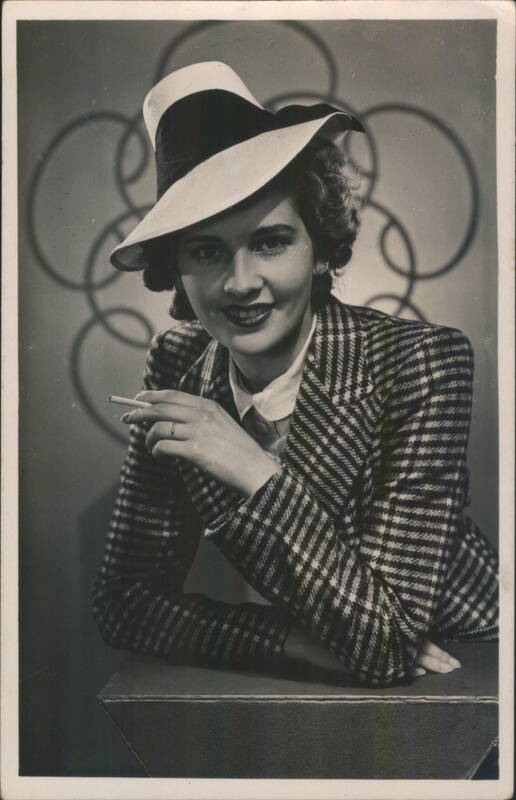 Woman in Plaid Blazer and Fedora Hat Smoking Women