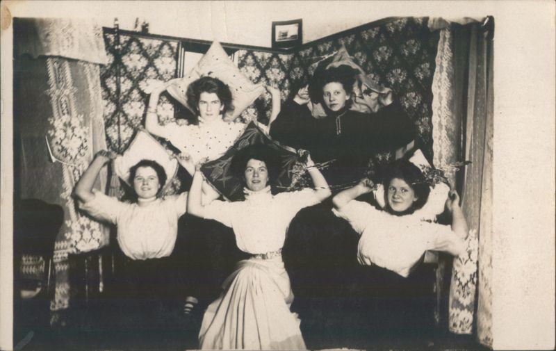 Five Women Holding Pillows Above Their Heads