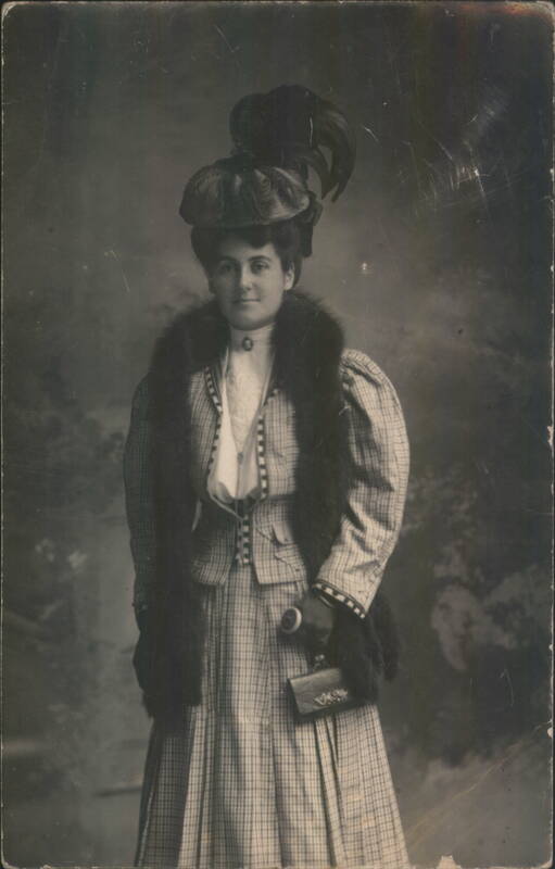 Woman in Plaid Suit and Fur Stole with Feathered Hat