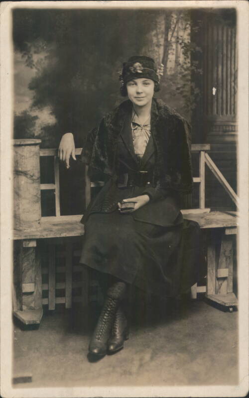 Portrait of a Young Woman Sitting on a Bench Women