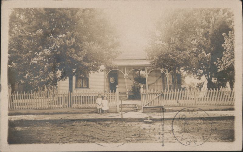 Two Children Standing in Front of a House Jonesboro Arkansas