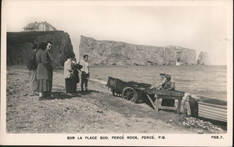 People on South Beach with Percé Rock QC Canada Quebec