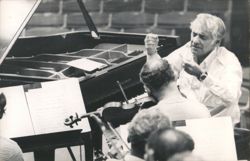 Leonard Bernstein Conducting Orchestra with Baldwin Piano Postcard