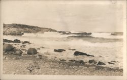 Ocean waves crashing on rocky shore with lobster trap Postcard