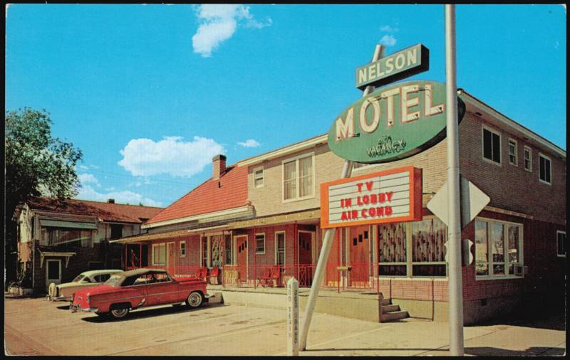 Nelson Motel Exterior with Large Sign and Classic Cars Elko Nevada
