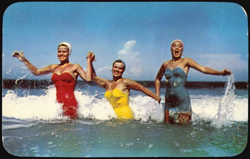 Three Women Surf Bathing the Year 'Round in Ocean Waves Florida