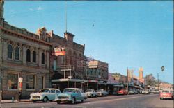 Yosemite Street with Live Oak Hotel and Classic Cars Postcard