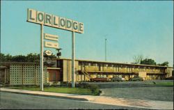 Carlsbad Lorlodge Motel with Neon Sign & Vintage Cars Postcard
