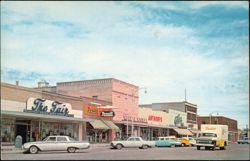 Sixth Street Business Section with Stores & Borden's Truck Postcard