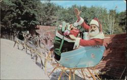Santa Greets You From His Sleigh At Santa'sWorkshop Postcard