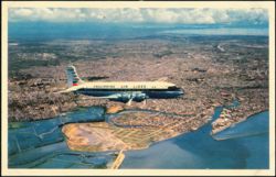 Philippine Air Lines DC-6 Flying Over Manila Postcard