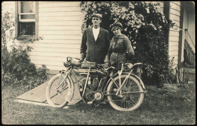 Couple with Early Indian Twin Cylinder Motorcycle Motorcycles