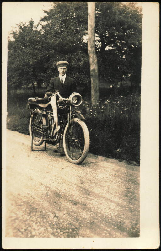 Man with Early Indian Motorcycle and Lily Dale Pennant