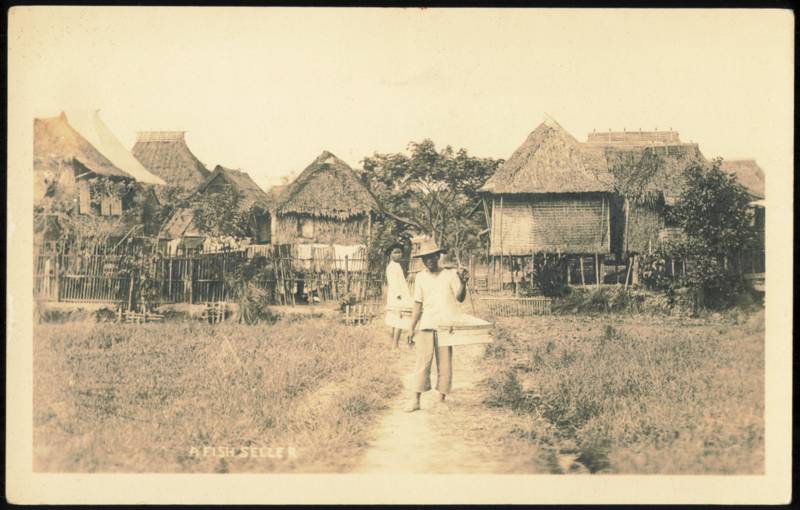 A Fish Seller with Carrying Pole and Thatched Huts Philippines