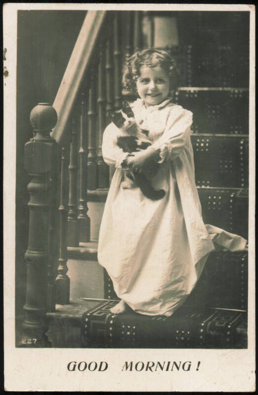 Good Morning! Little Girl in Nightgown Holding Kitten