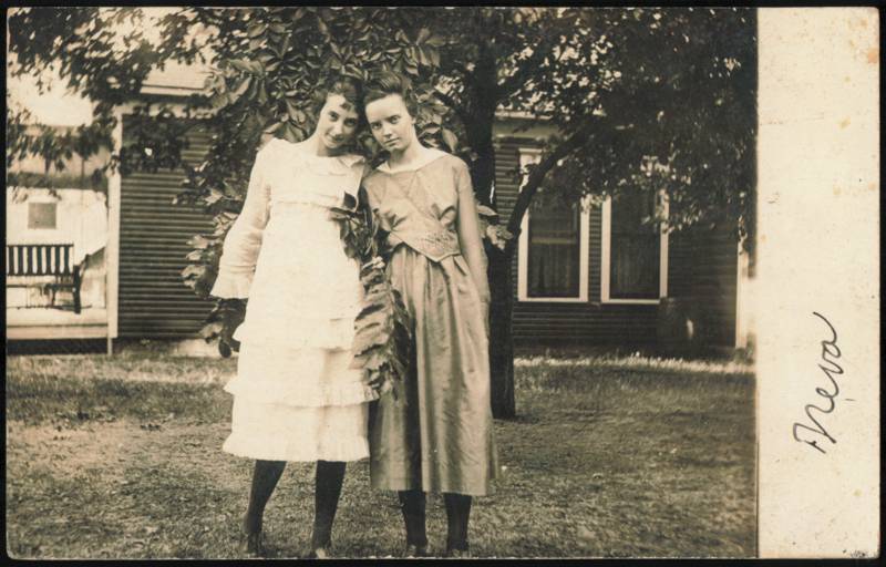 Two Young Women Outdoors by House, Inscribed Neva