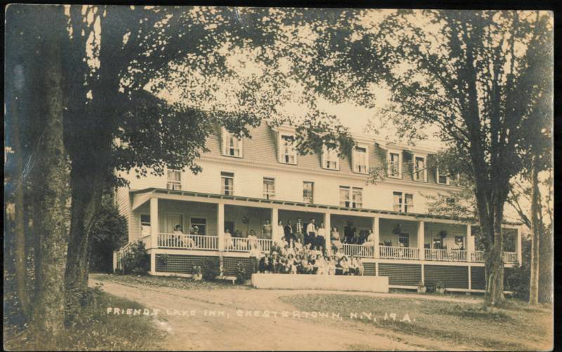 Friends Lake Inn with Guests on Porch Chestertown New York