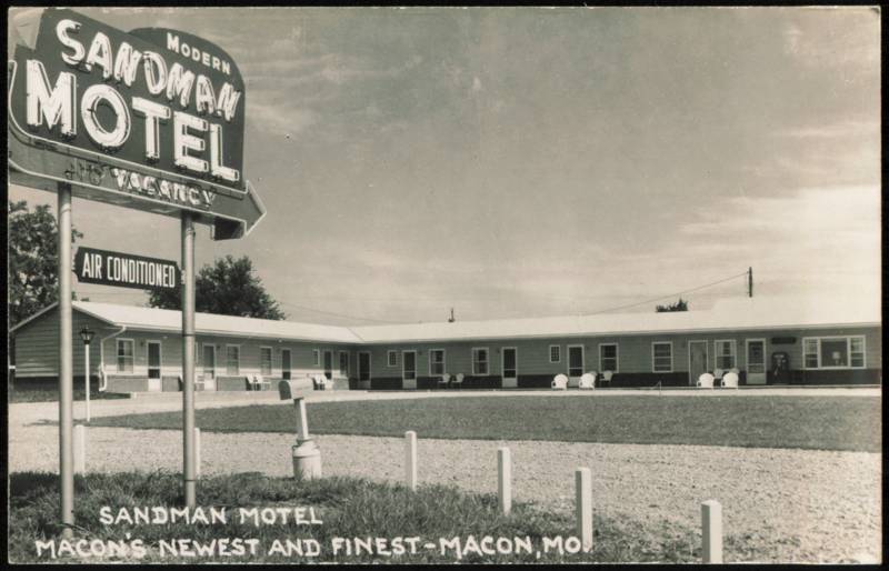 Modern Sandman Motel with Prominent Neon Sign Macon Missouri