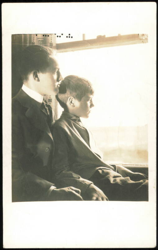 Man and Boy Looking Out Window Children