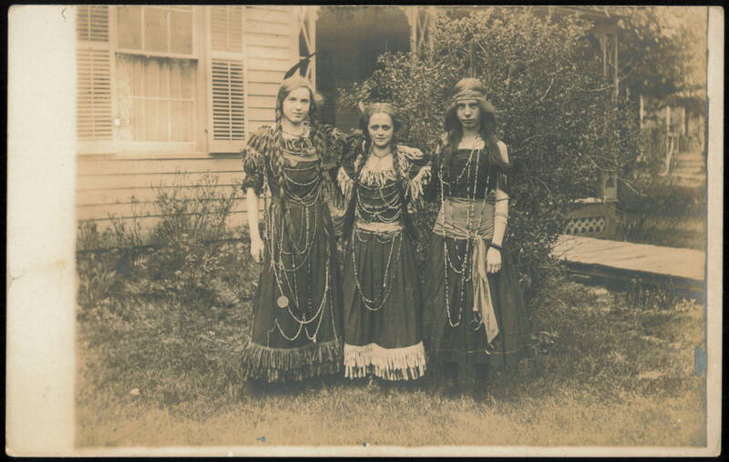 Three Girls in Native American Themed Costumes Women