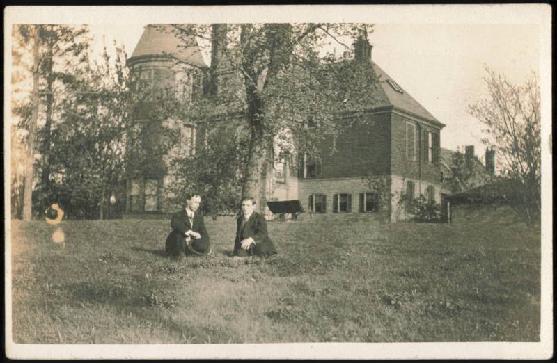 Two Men Posed on Lawn Before Large Victorian Estate or School