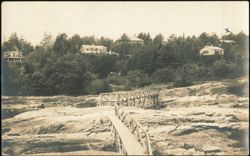 Taft Cottage and Rustic Footbridge Across Rocks Postcard