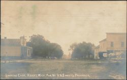 Looking East Street Scene with Horse-Drawn Carriage Postcard